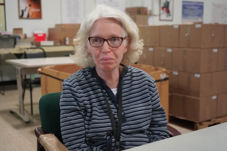 CVR program participant seated at a table in a workroom.
